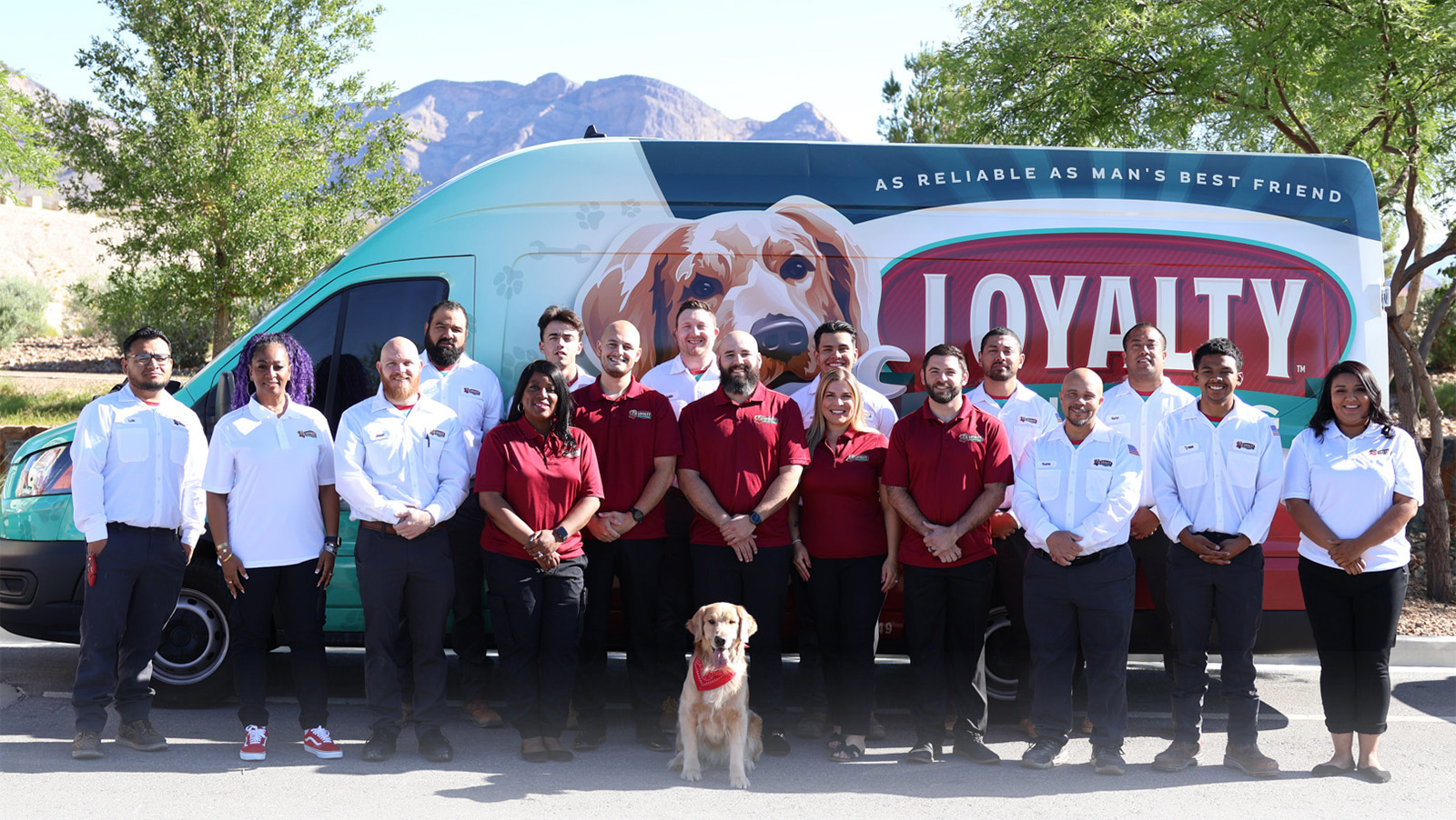 Buddy with the Loyalty Plumbing & Air team in front of a company van